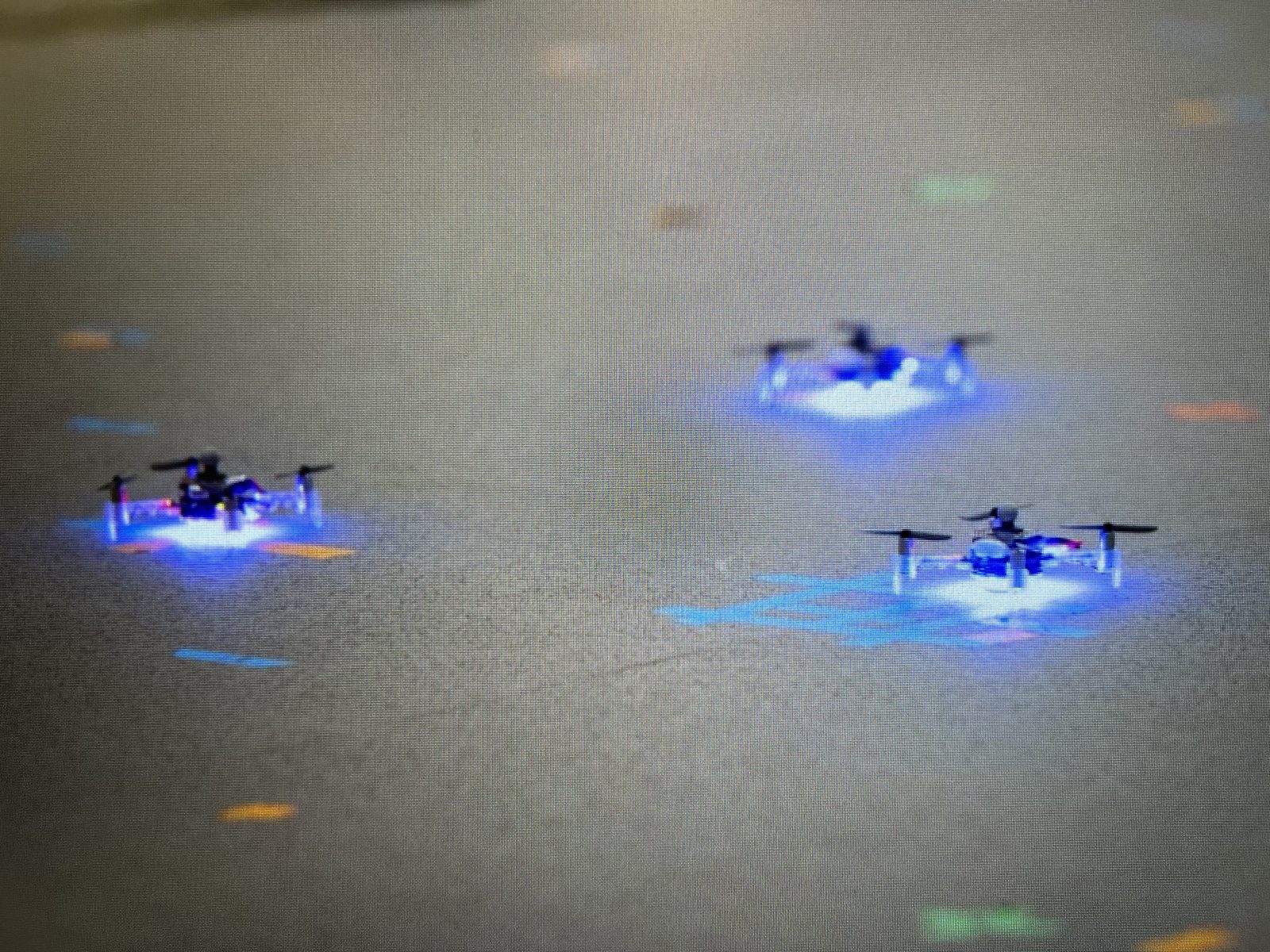 Crazyflies drones in flight during a downwash control test